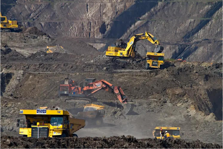 Dynamic Metals & Mining Operations: Gleaming machinery against a backdrop of rugged terrain.